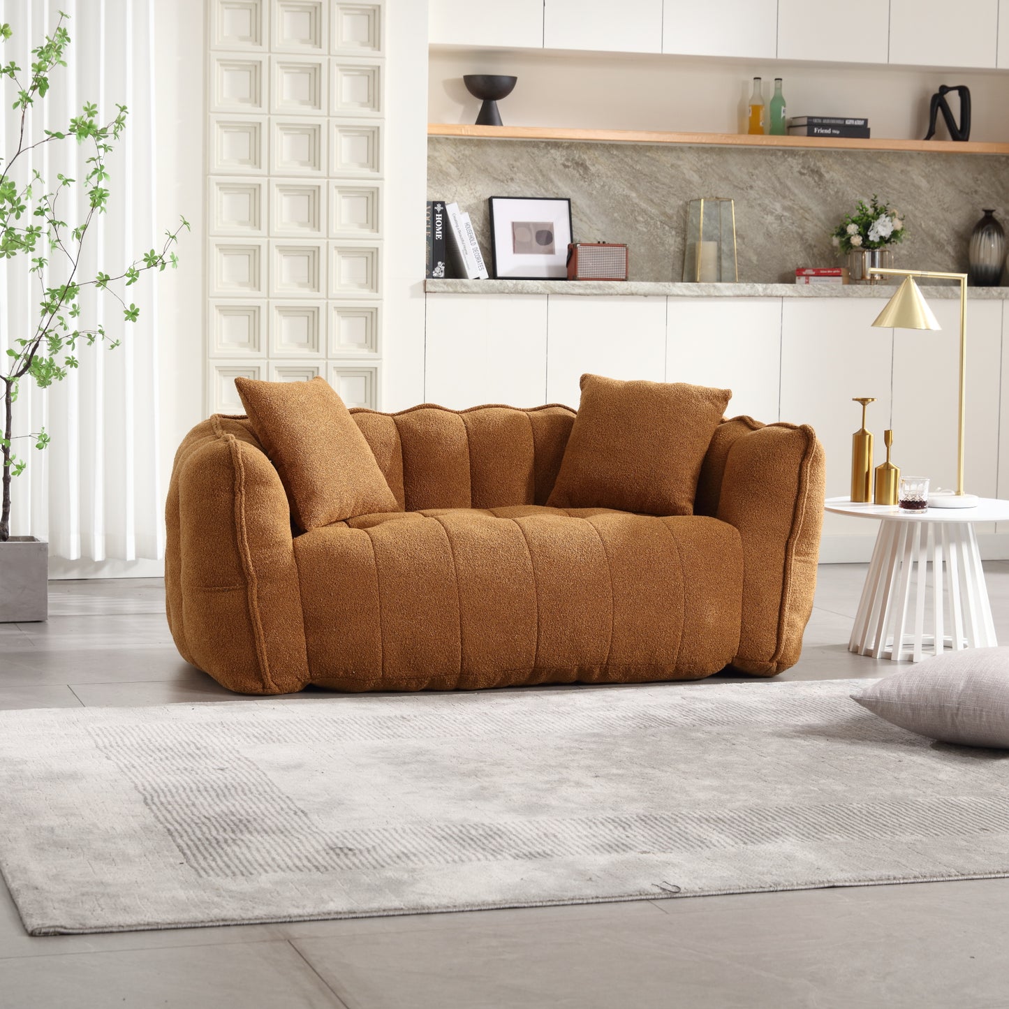 Cozy brown boucle sofa with plush throw pillows perfect for a living room