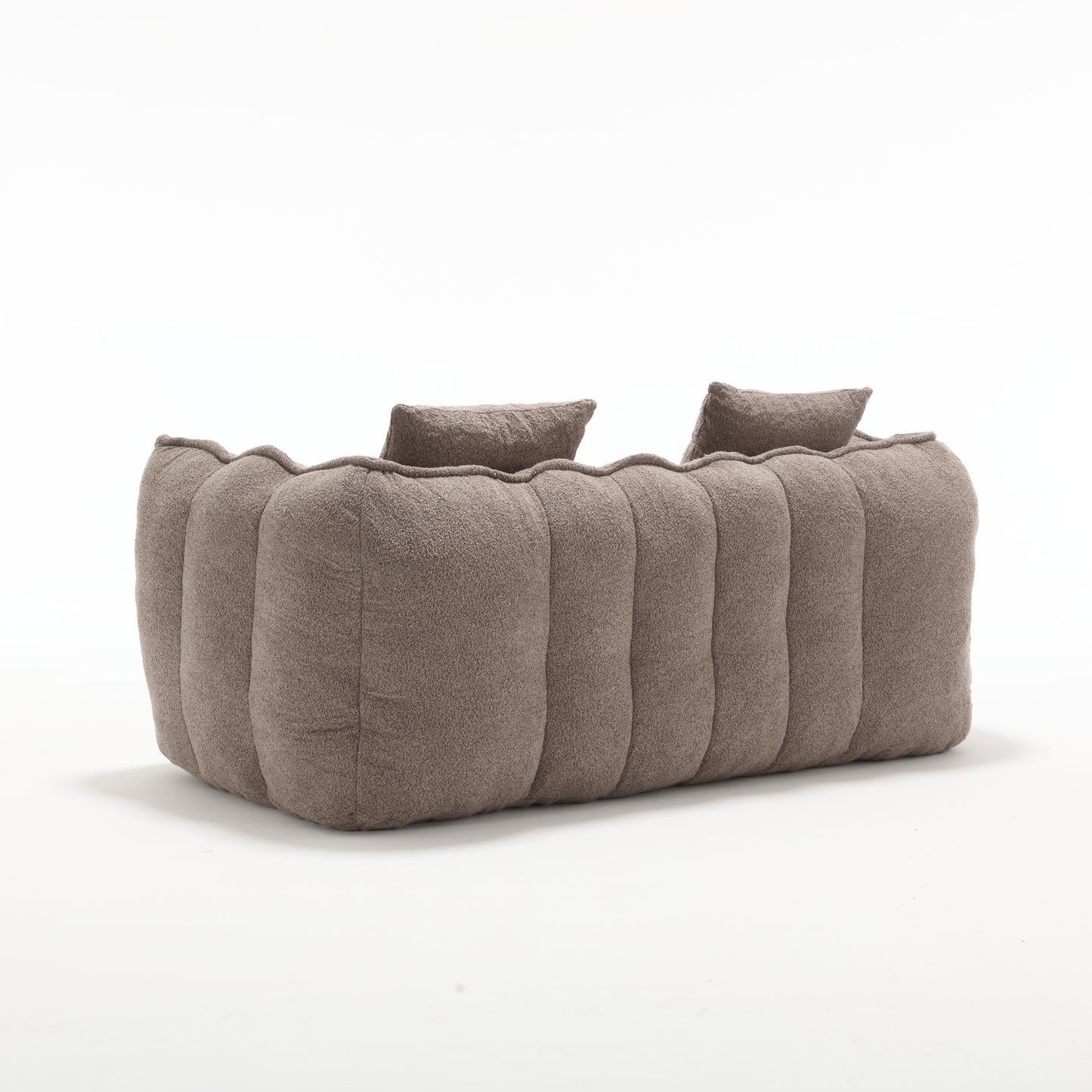 Plush taupe upholstered sectional sofa with cloudlike vertical tufting for modern living rooms