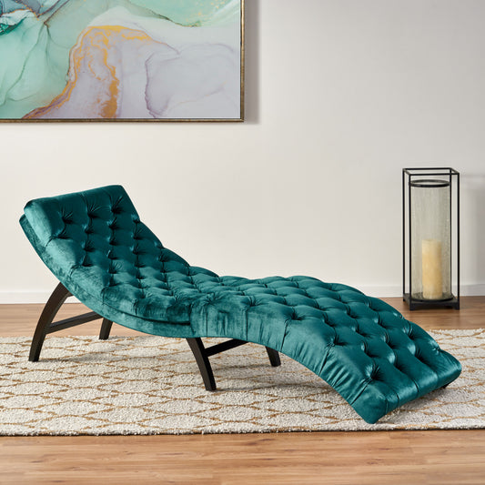 Teal velvet tufted chaise lounge with dark wood legs perfect for a modern living room