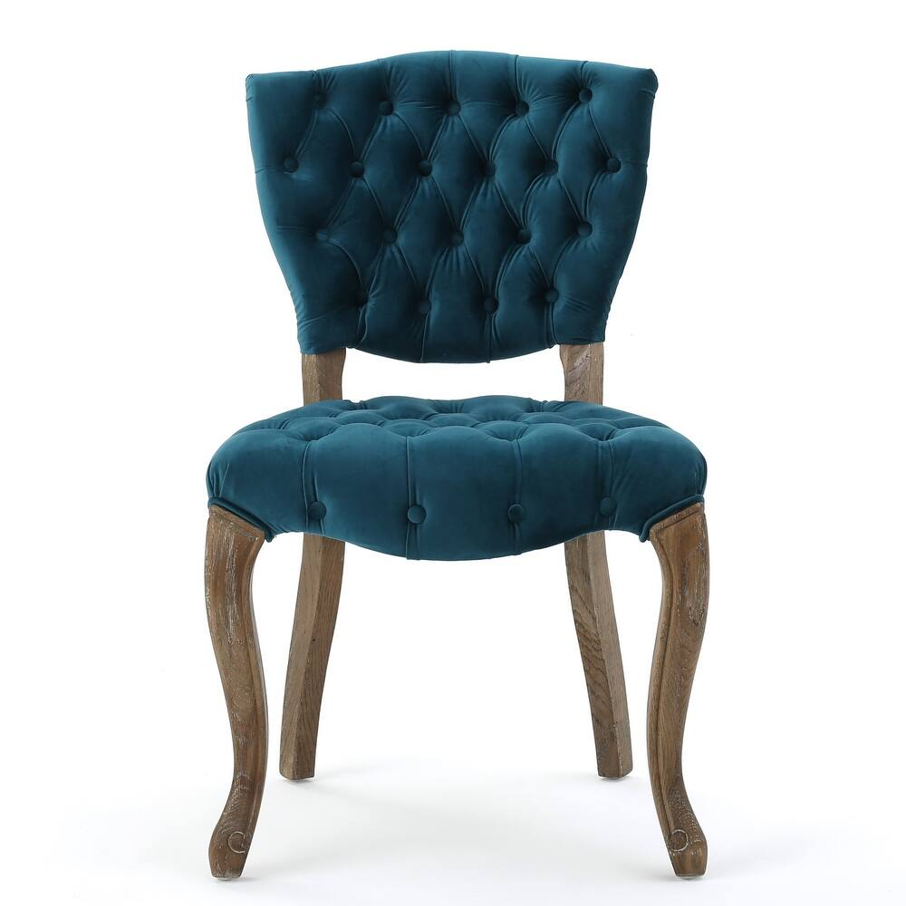 Tufted teal velvet accent chair with curved wooden legs for dining or living room