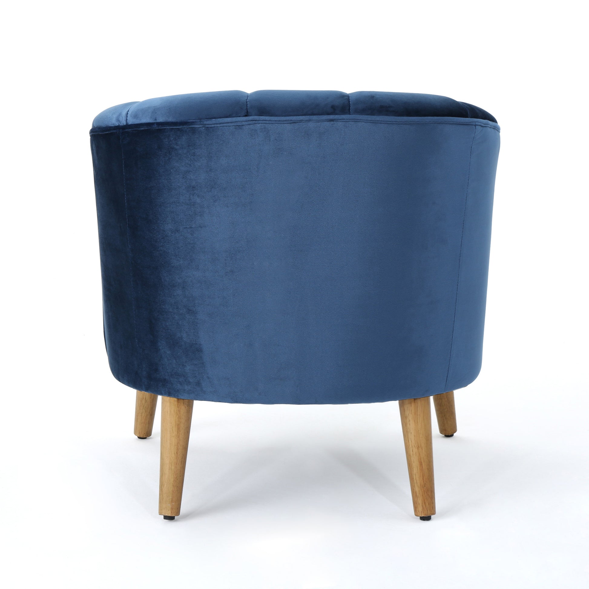 Deep blue velvet barrel accent chair with tufted back and wooden legs