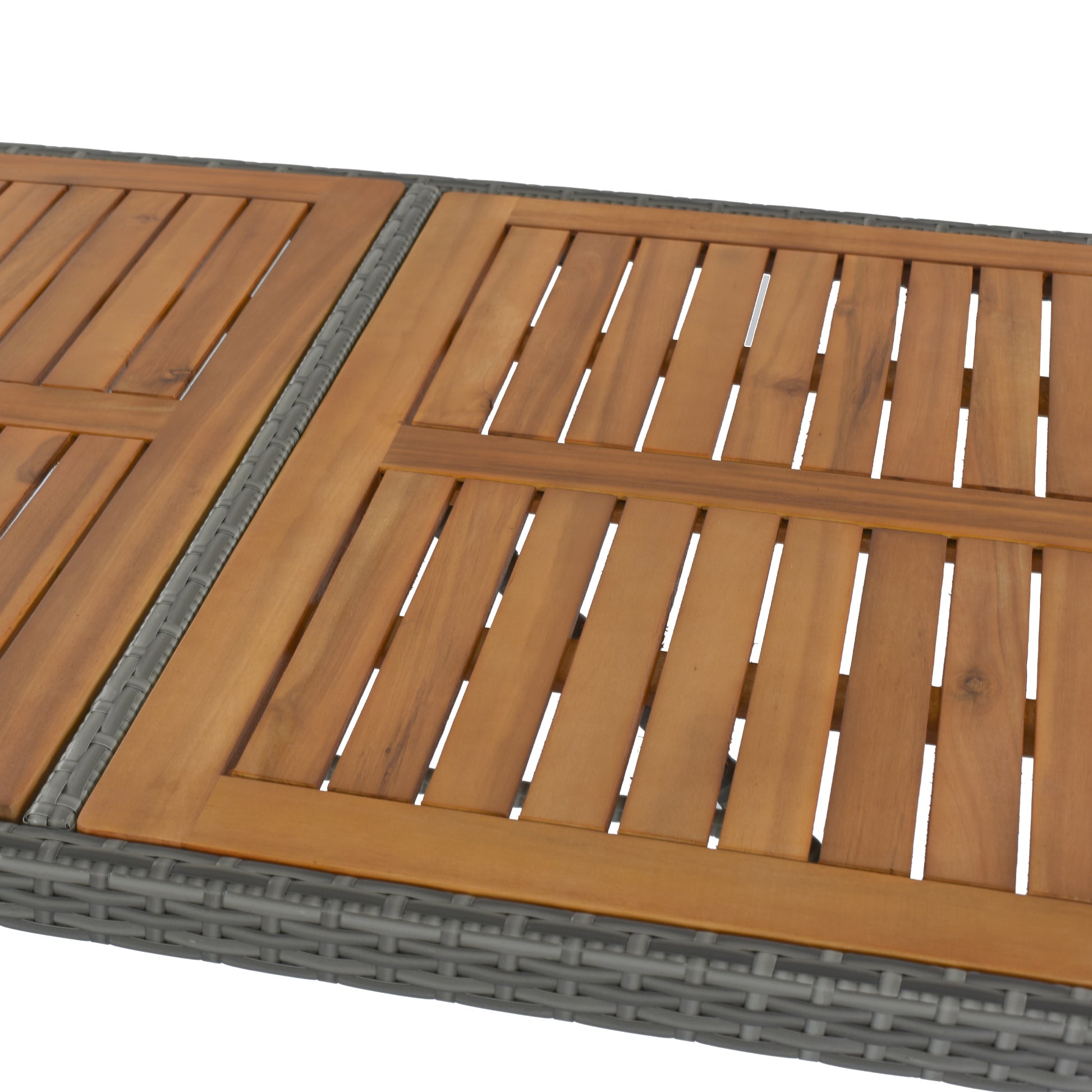 Closeup of a slatted wooden patio table with grey wicker frame perfect for outdoor dining