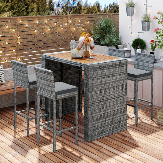 Grey wicker outdoor bar set with wooden tabletop and comfortable seating