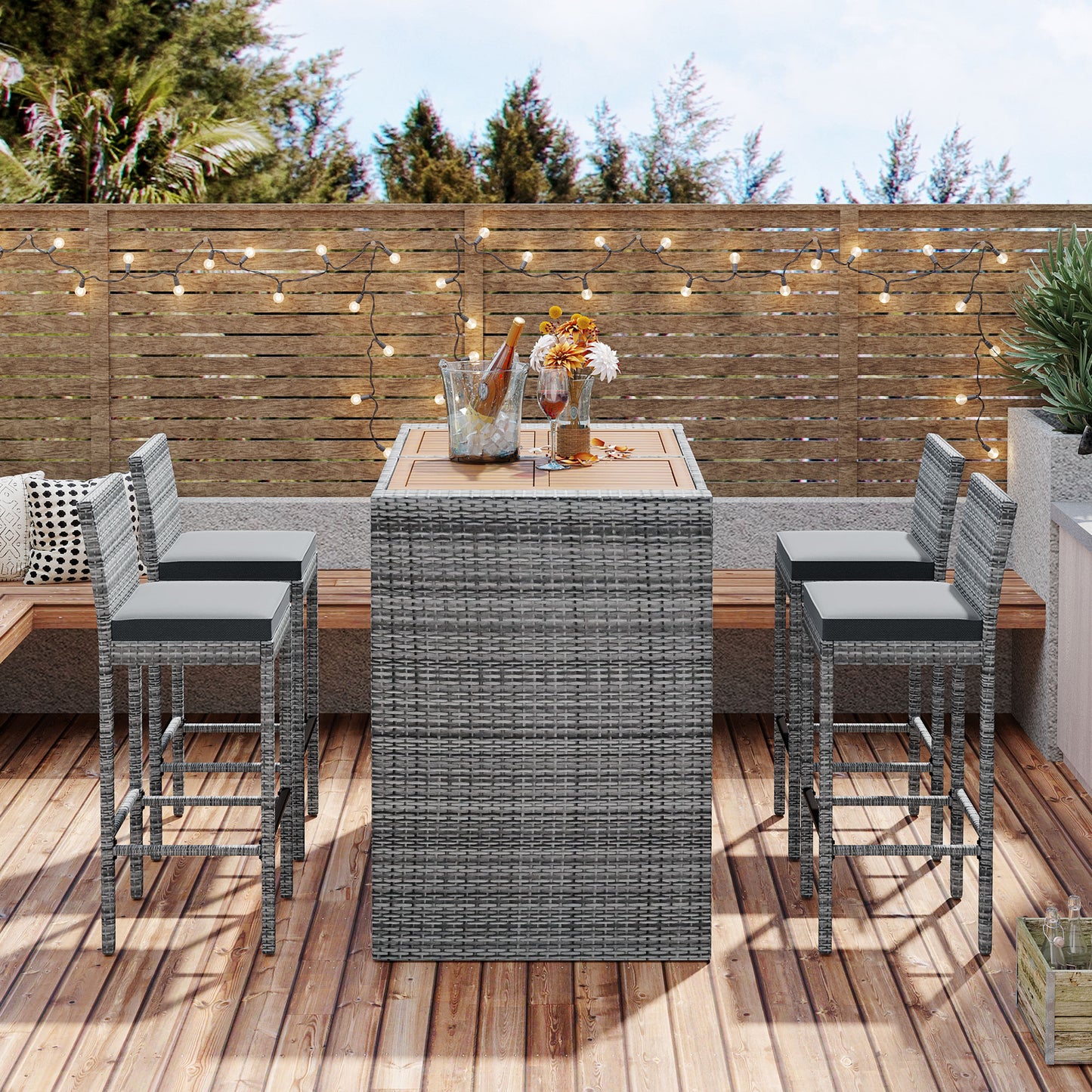 Gray rattan bar stools with plush seat cushions perfect for outdoor entertaining