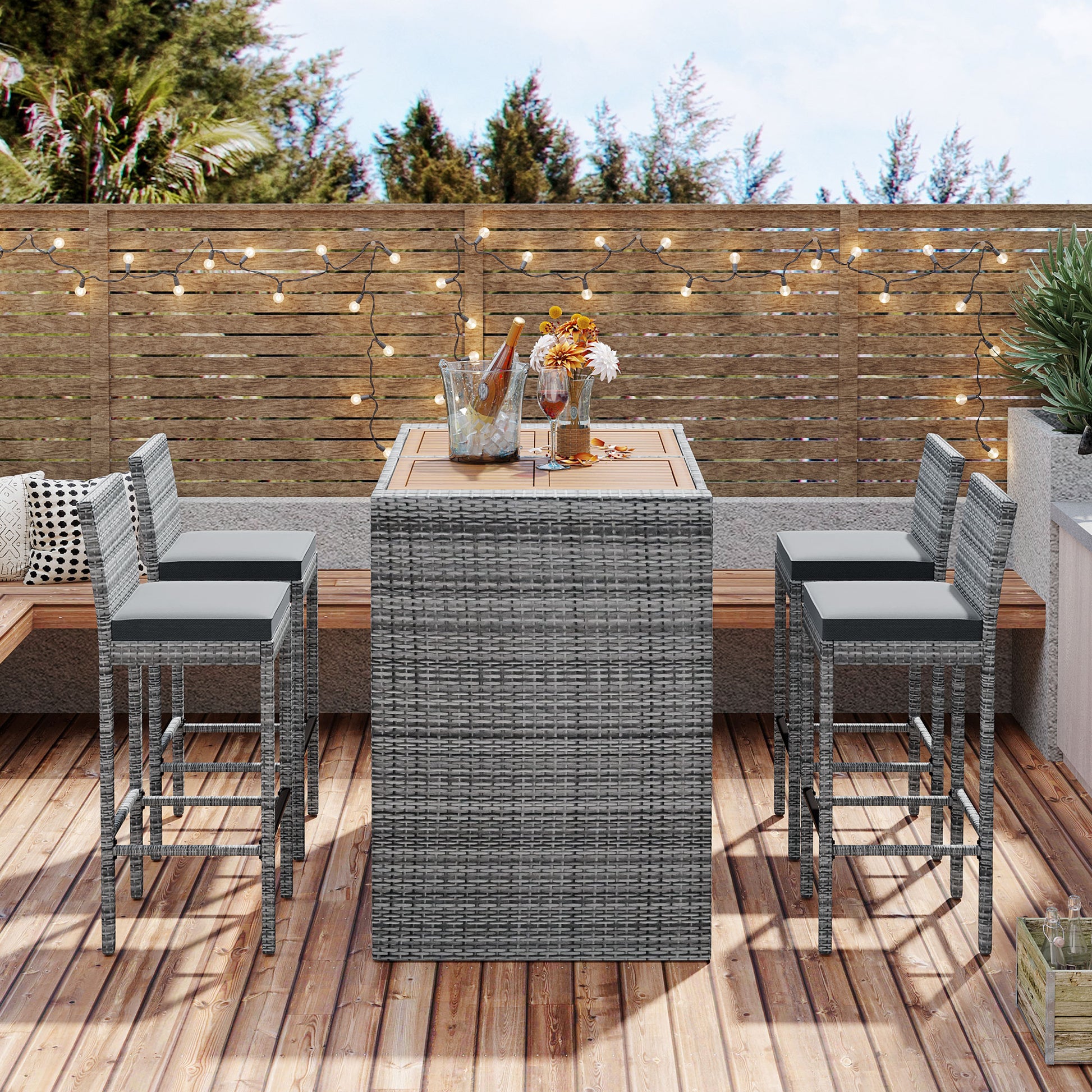 Gray rattan bar stools with plush seat cushions perfect for outdoor entertaining