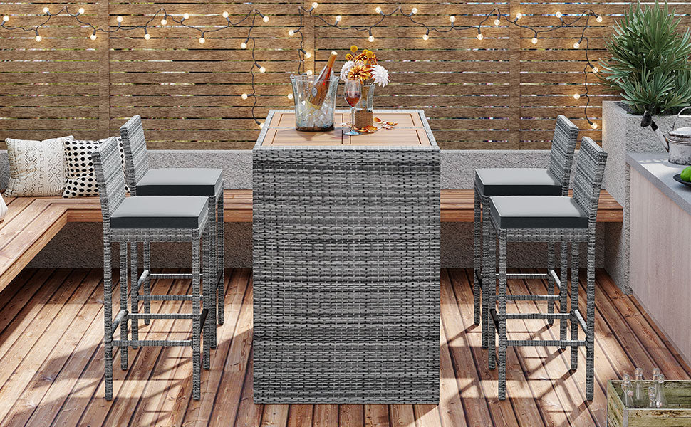 Gray wicker bar stools with dark cushions perfect for outdoor patio seating