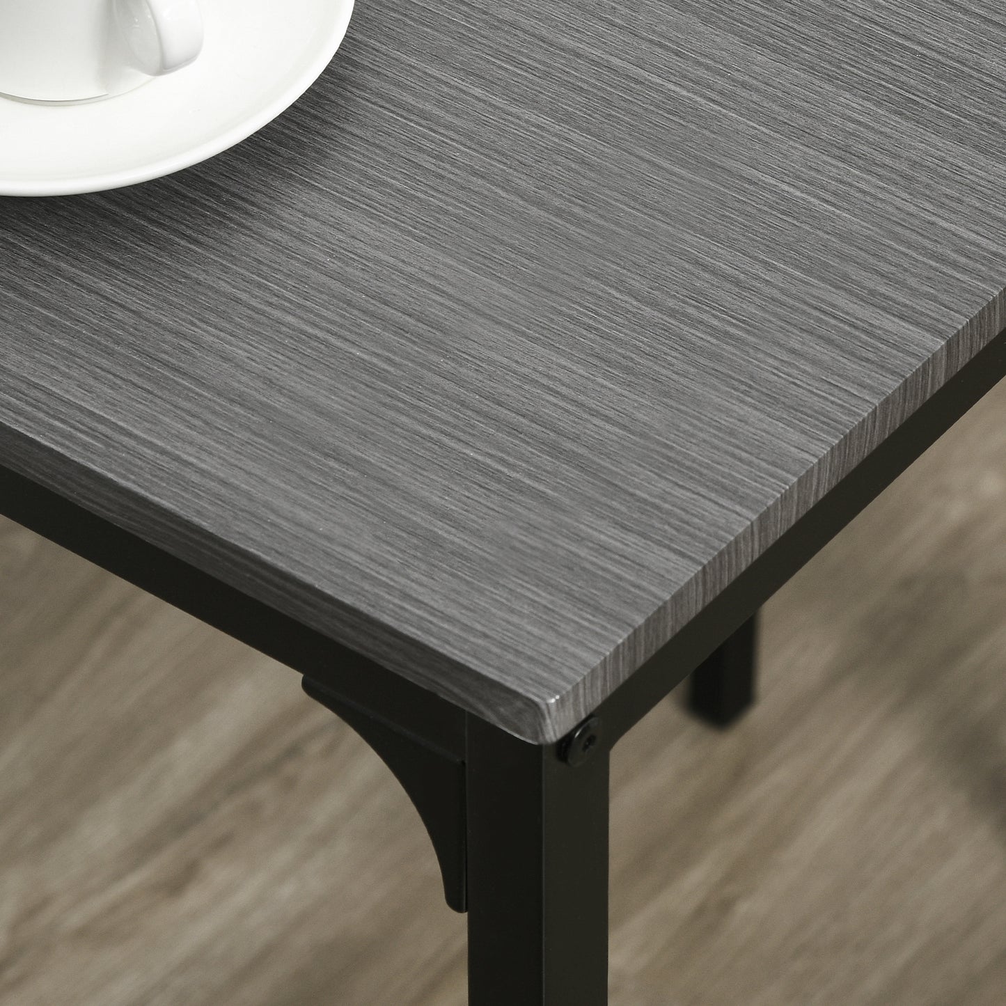 Gray wood grain laminate table top with black metal legs