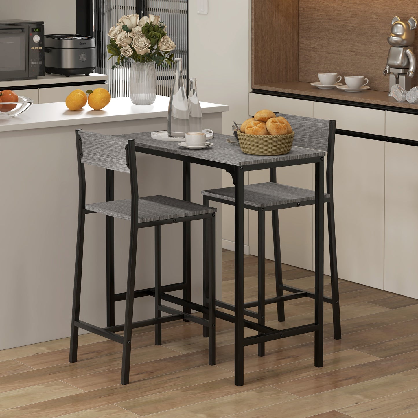 Gray wood counter height table with black metal frame and two matching stools