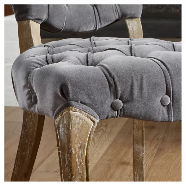 Grey velvet tufted accent chair with carved wooden legs