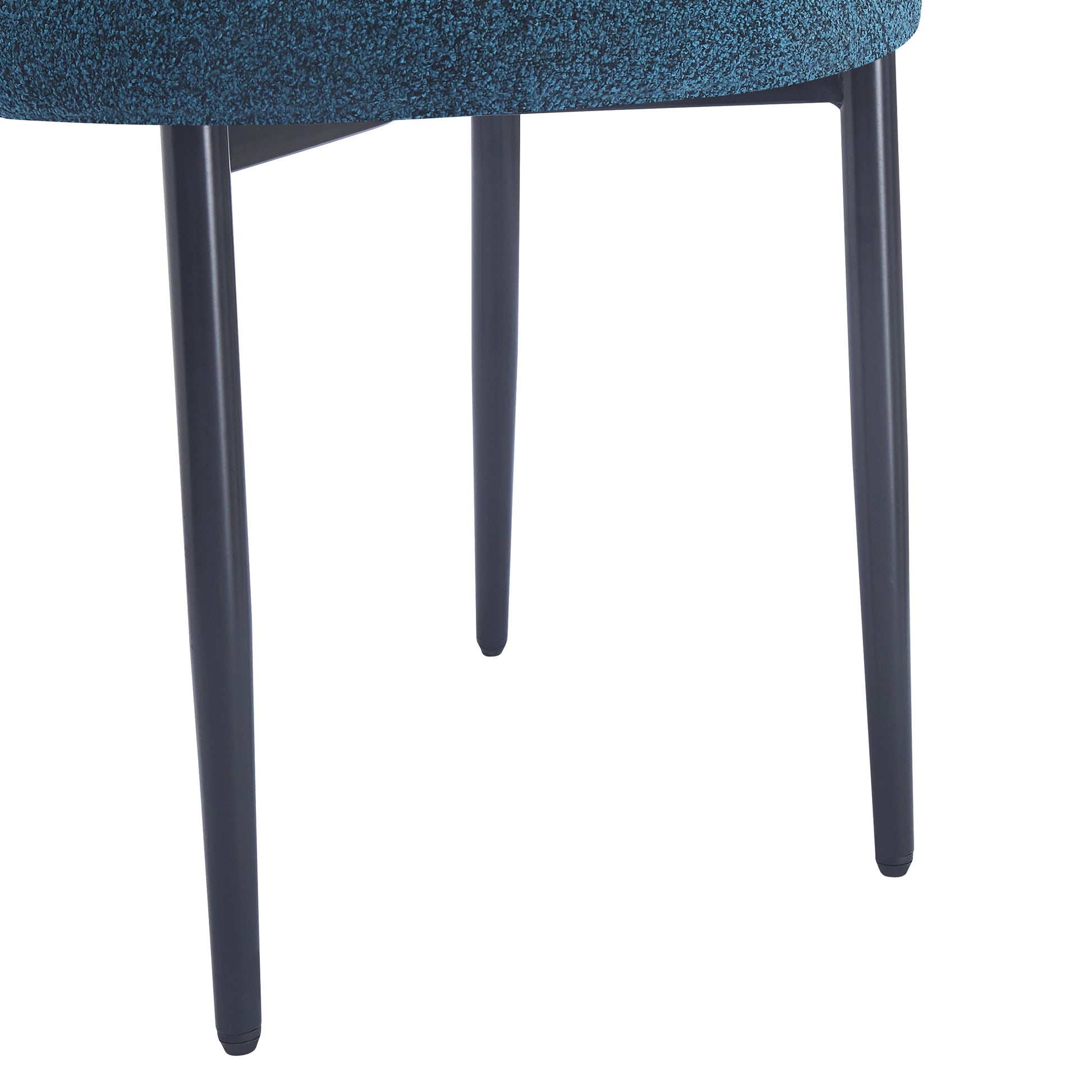Textured teal fabric seat on a modern chair with dark grey tapered legs
