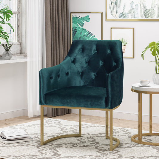 Deep emerald velvet armchair with tufted back and gold legs