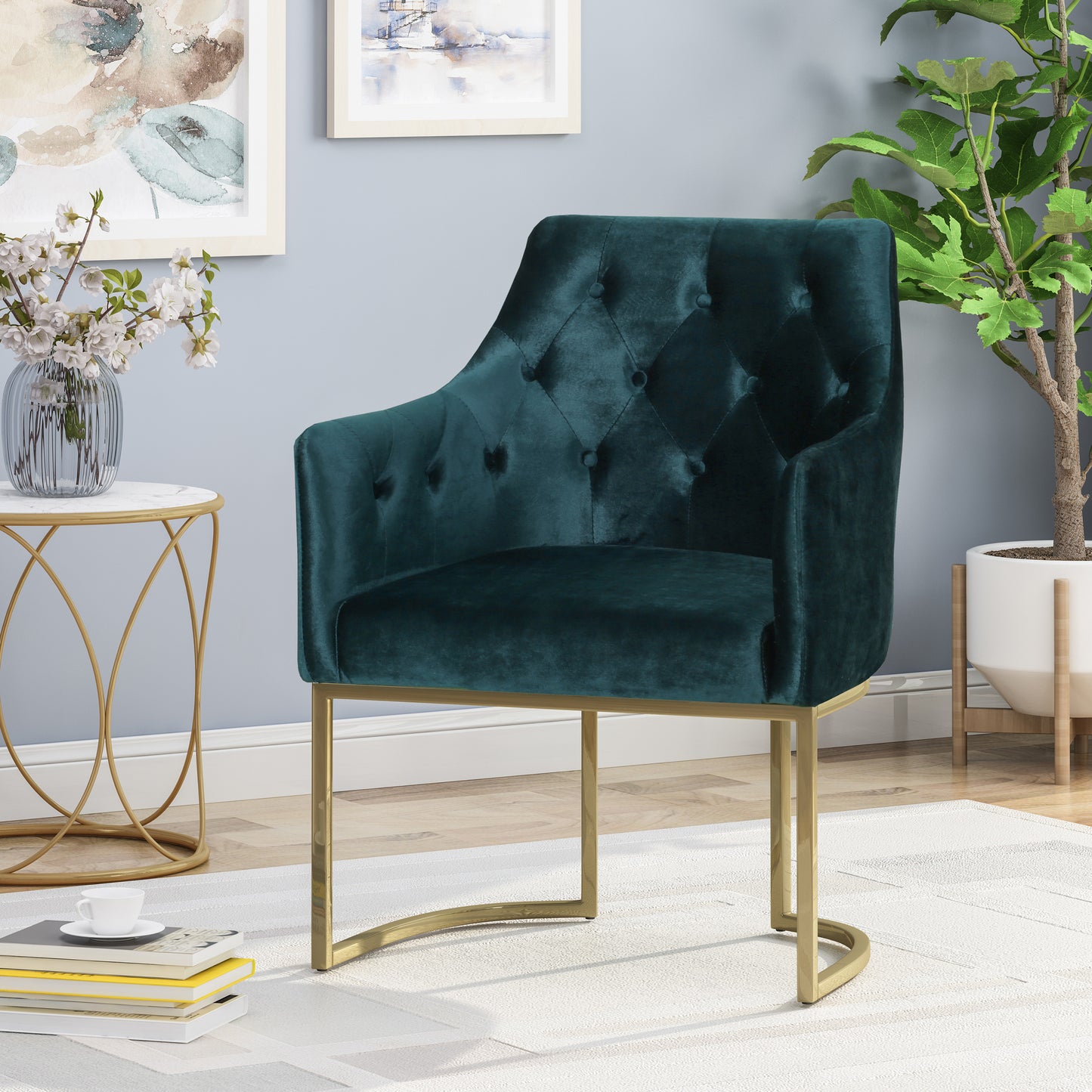 Deep emerald green velvet armchair with button tufting and gold metal legs