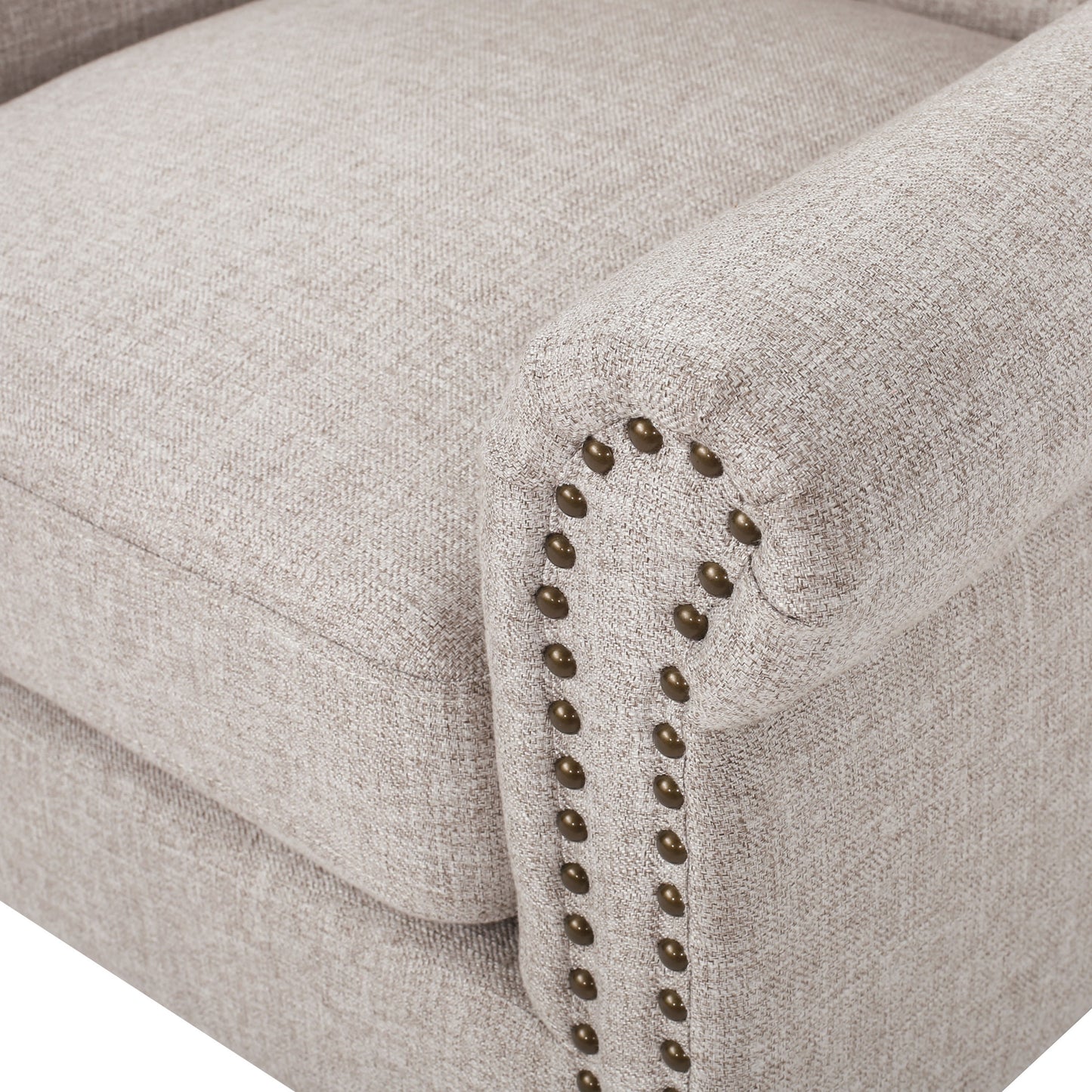 Beige upholstered accent chair with decorative nailhead trim