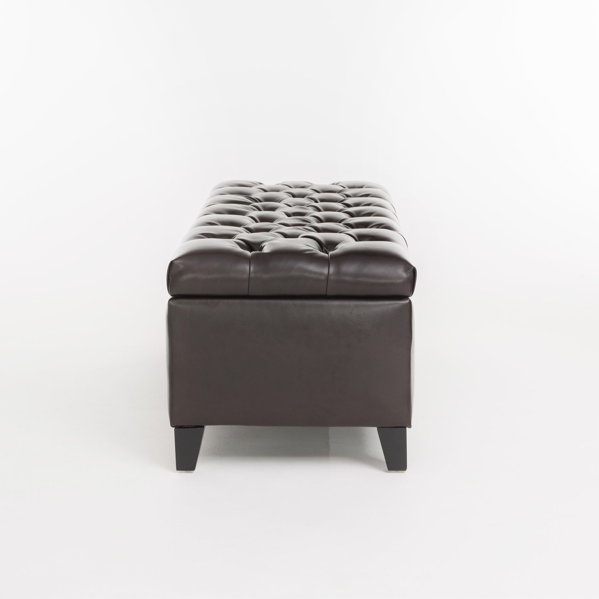 Tufted dark brown faux leather storage bench with short black legs
