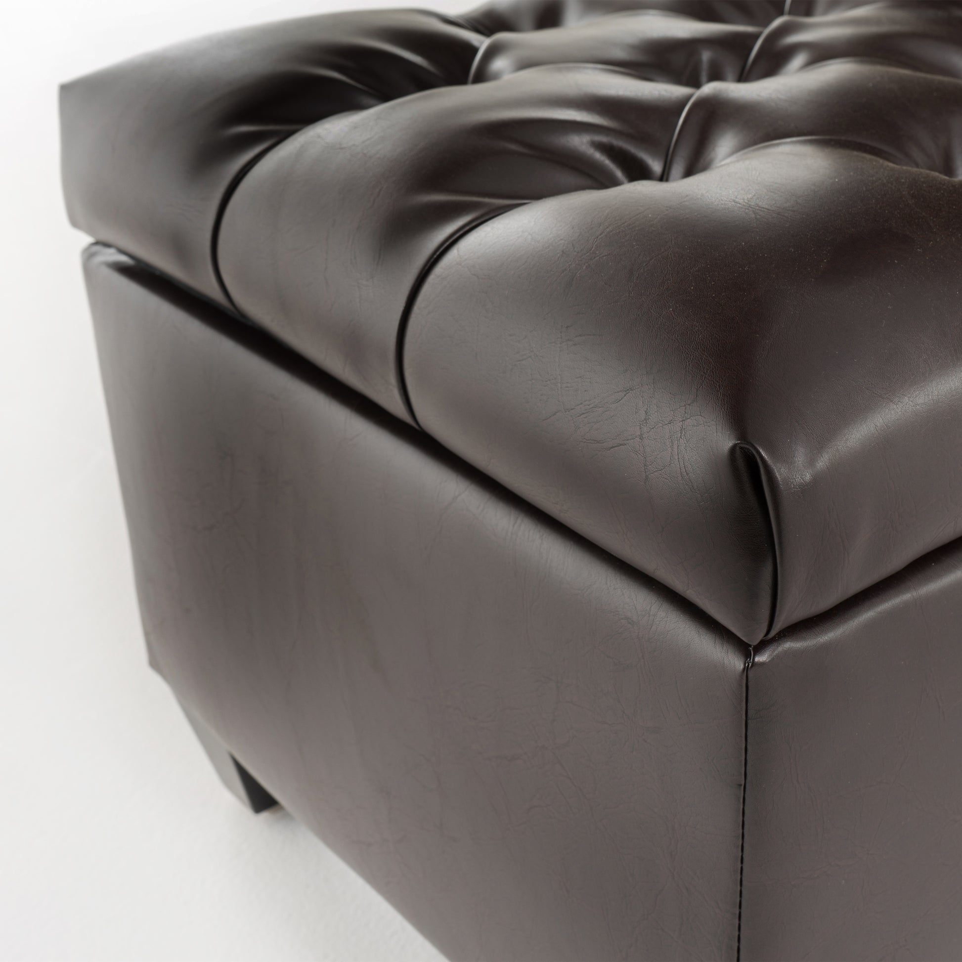 Dark brown tufted faux leather storage ottoman with button details for modern living rooms