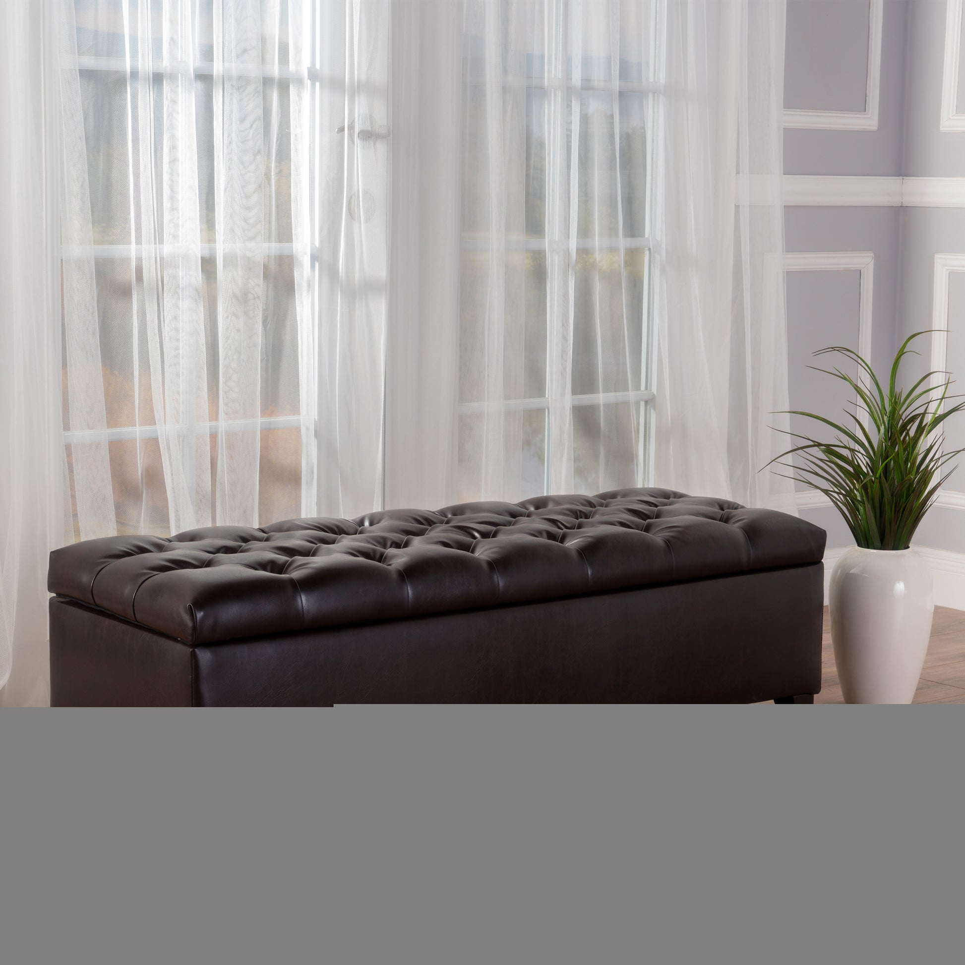 Dark brown faux leather storage ottoman with tufted top perfect for entryway