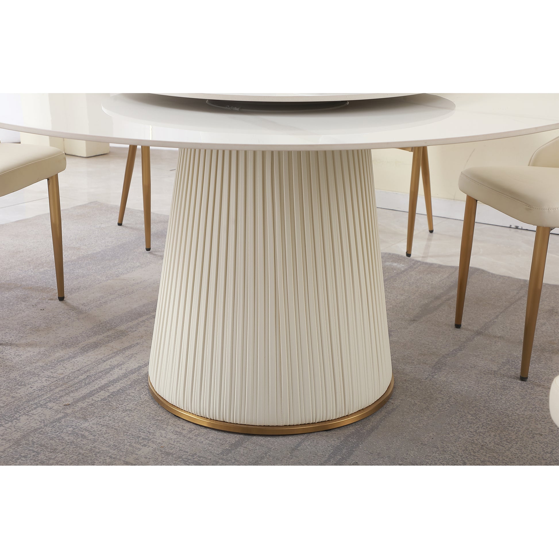 White fluted pedestal base dining table with gold trim