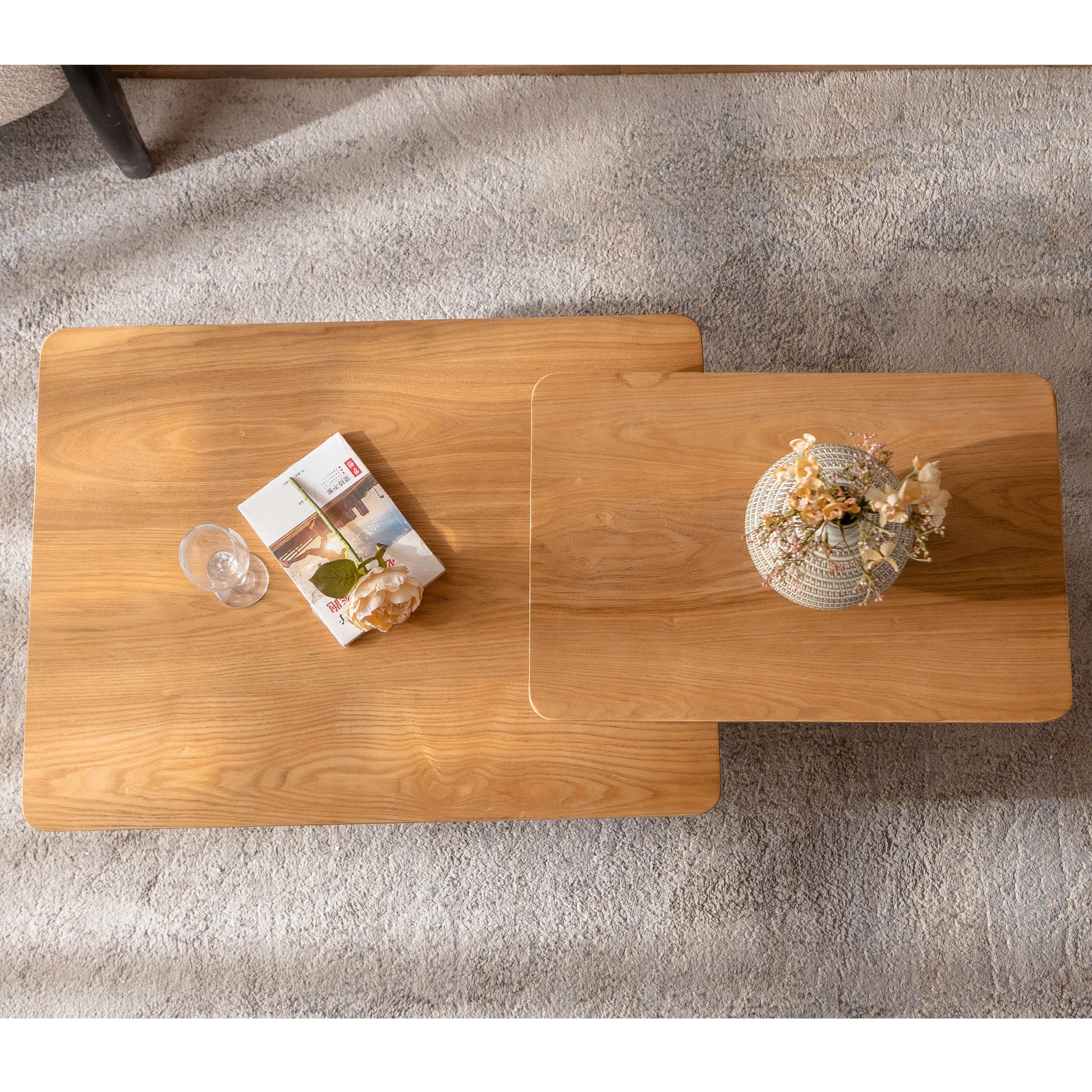 Modern nesting coffee tables in natural oak with rounded edges and a subtle wood grain