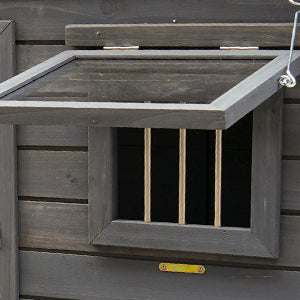 Dark grey wooden chicken coop window with hinged opening and metal bars