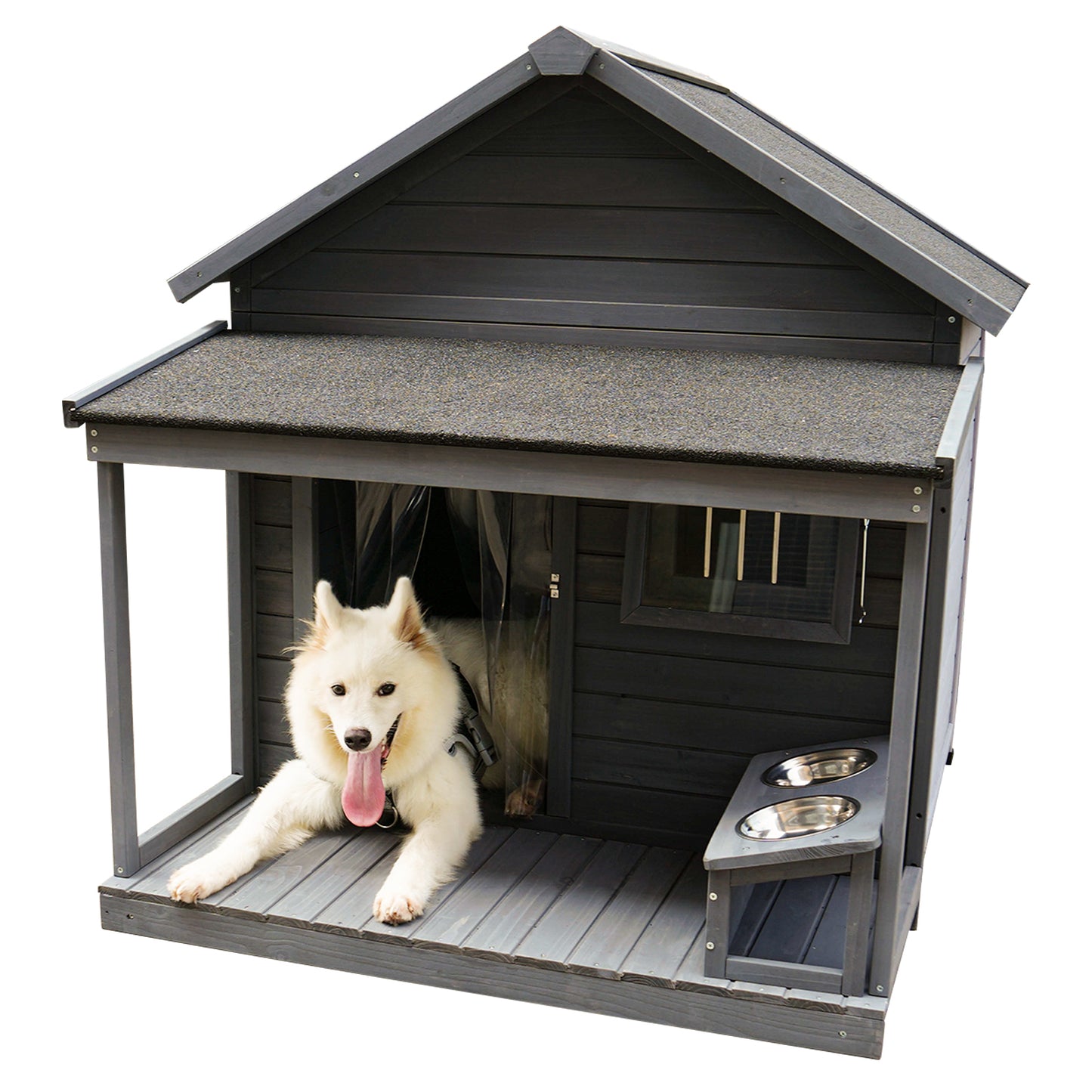 Dark gray wooden dog house with porch window and elevated double bowls A white Samoyed dog rests on the porch