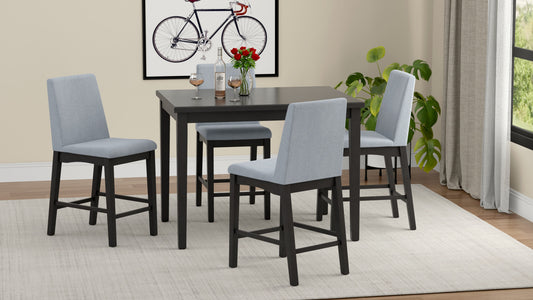 Set of four light blue upholstered counter stools with dark wood frames arranged around a dark wood table