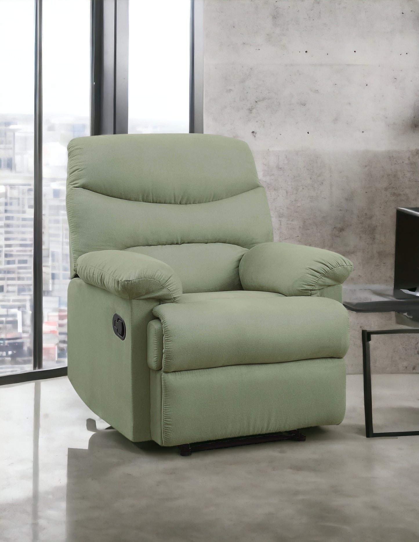 Sage green recliner chair with plush cushioning and side lever for reclining