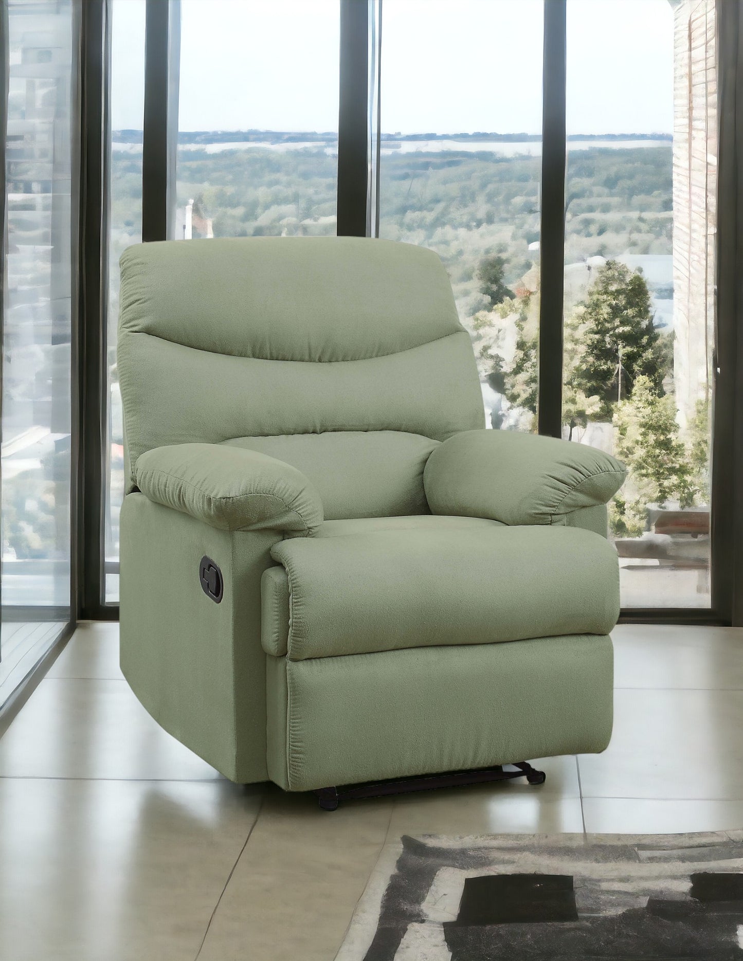 Sage green fabric recliner chair with plush cushioning and lever on side
