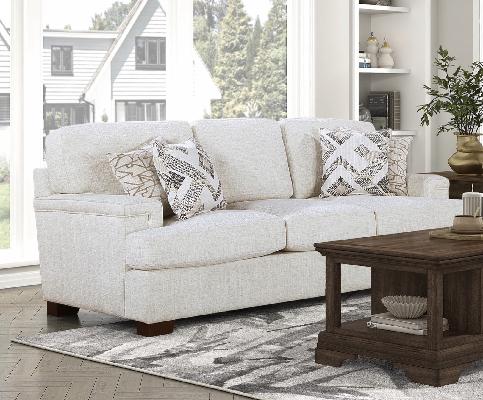 Cream fabric sectional sofa with geometric accent pillows for modern living room