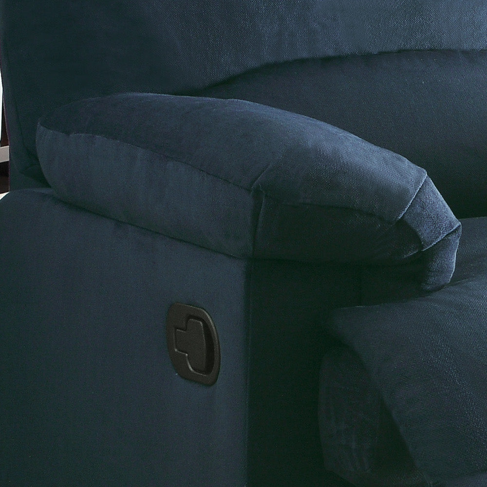 Closeup of a plush navy blue recliner armrest with a side lever