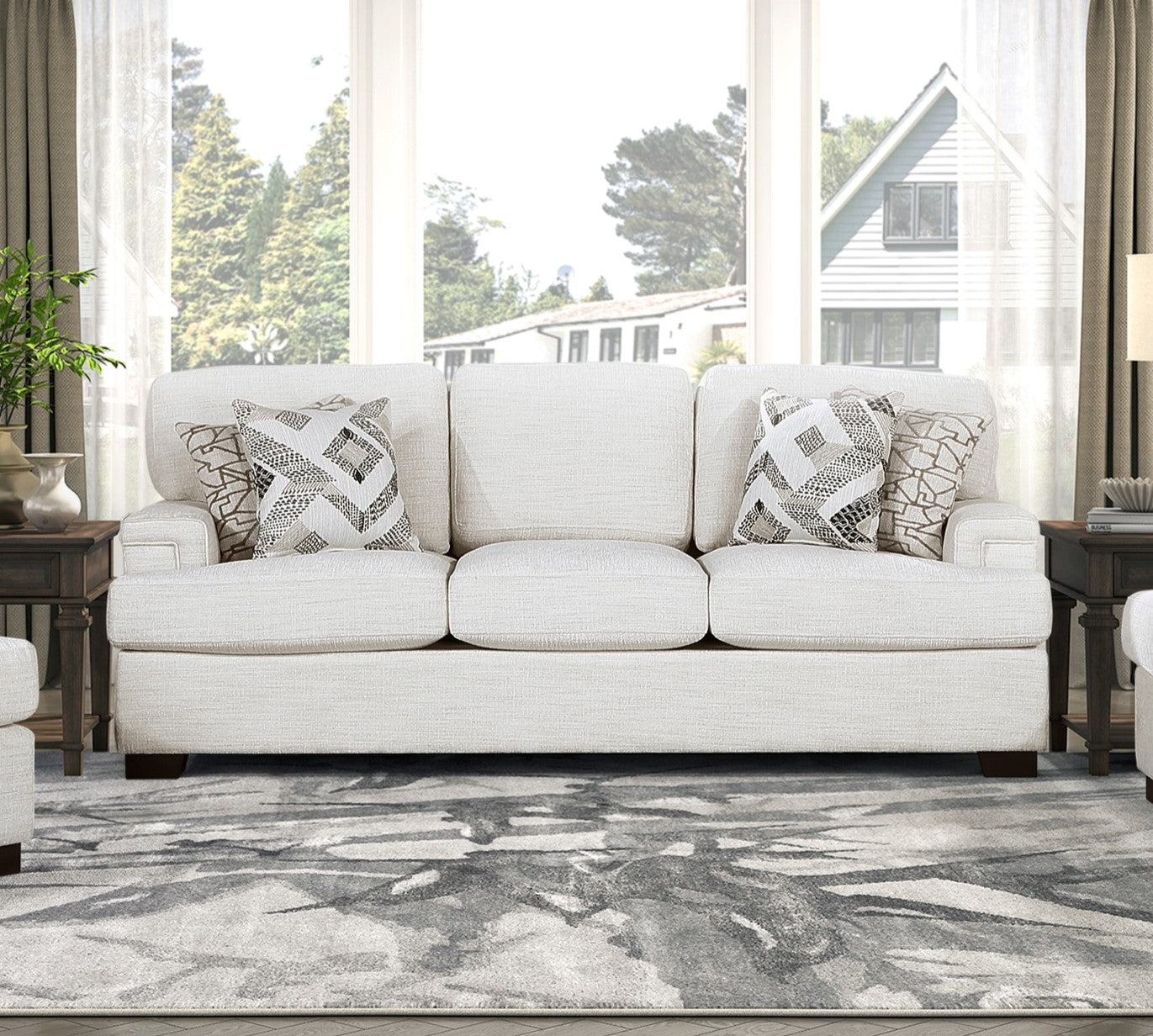 Cream textured fabric sofa with geometric throw pillows ideal for living room seating
