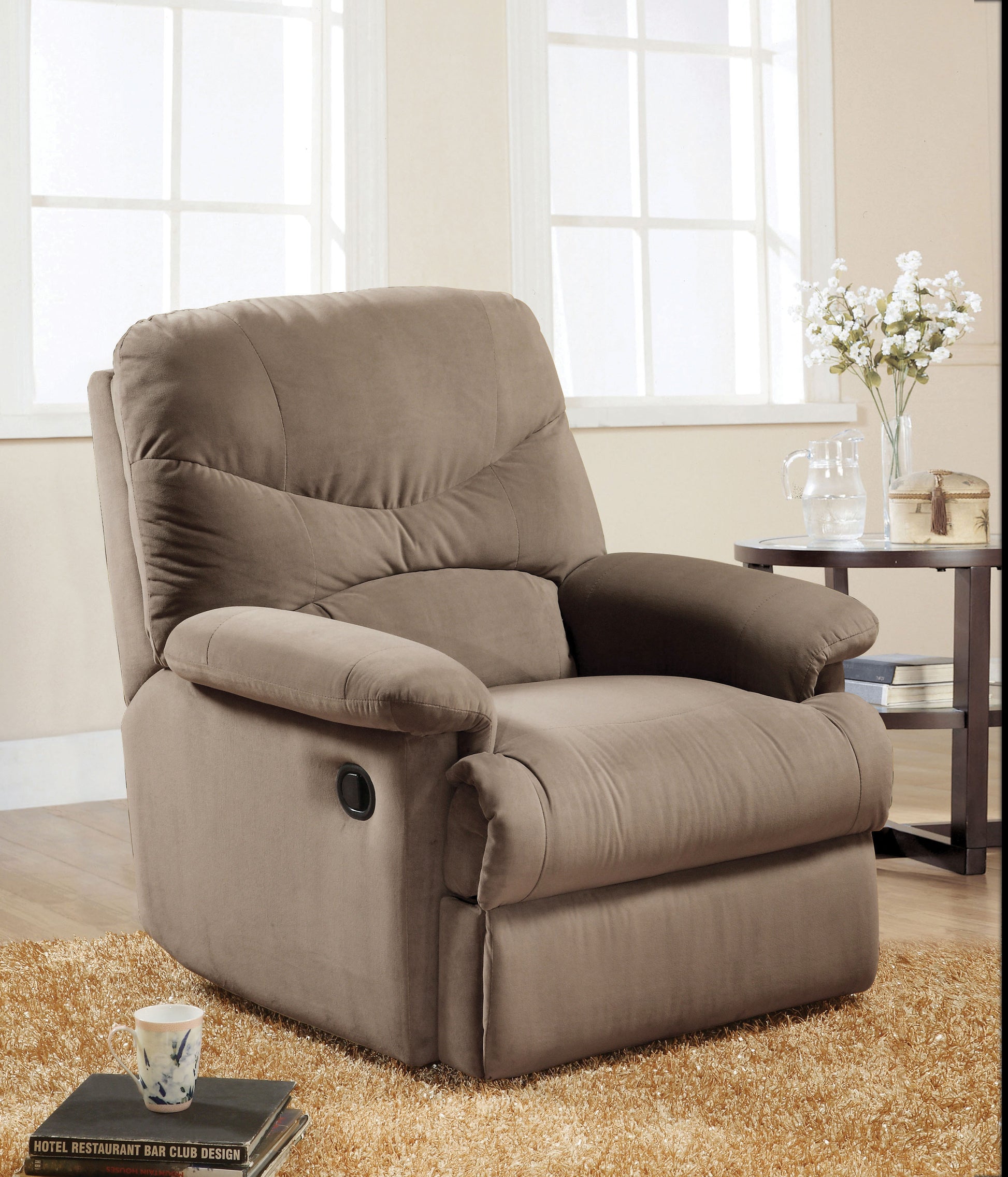 Plush taupe fabric recliner chair with padded arms and a side lever for comfortable seating