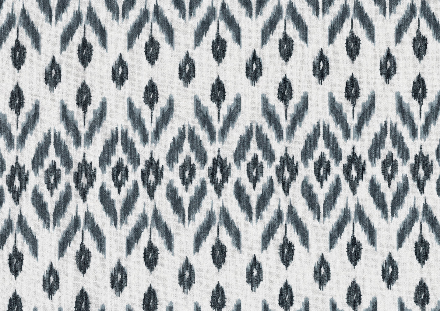 White and grey ikat fabric with a repeating diamond pattern perfect for home decor