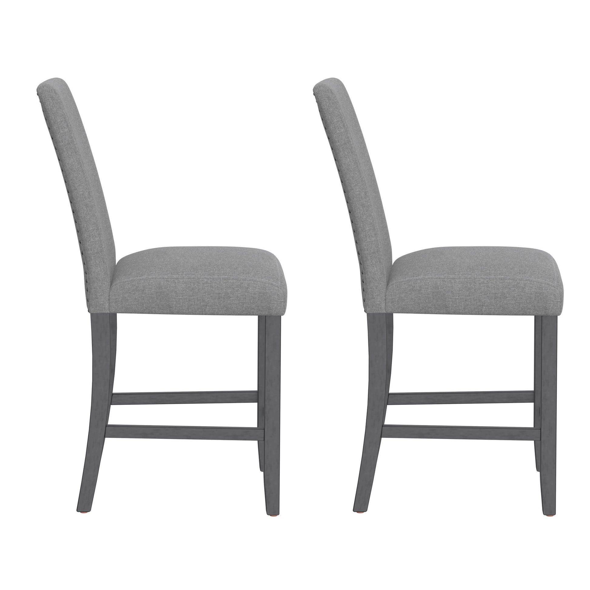 Two grey fabric dining chairs with dark wood legs shown from the side
