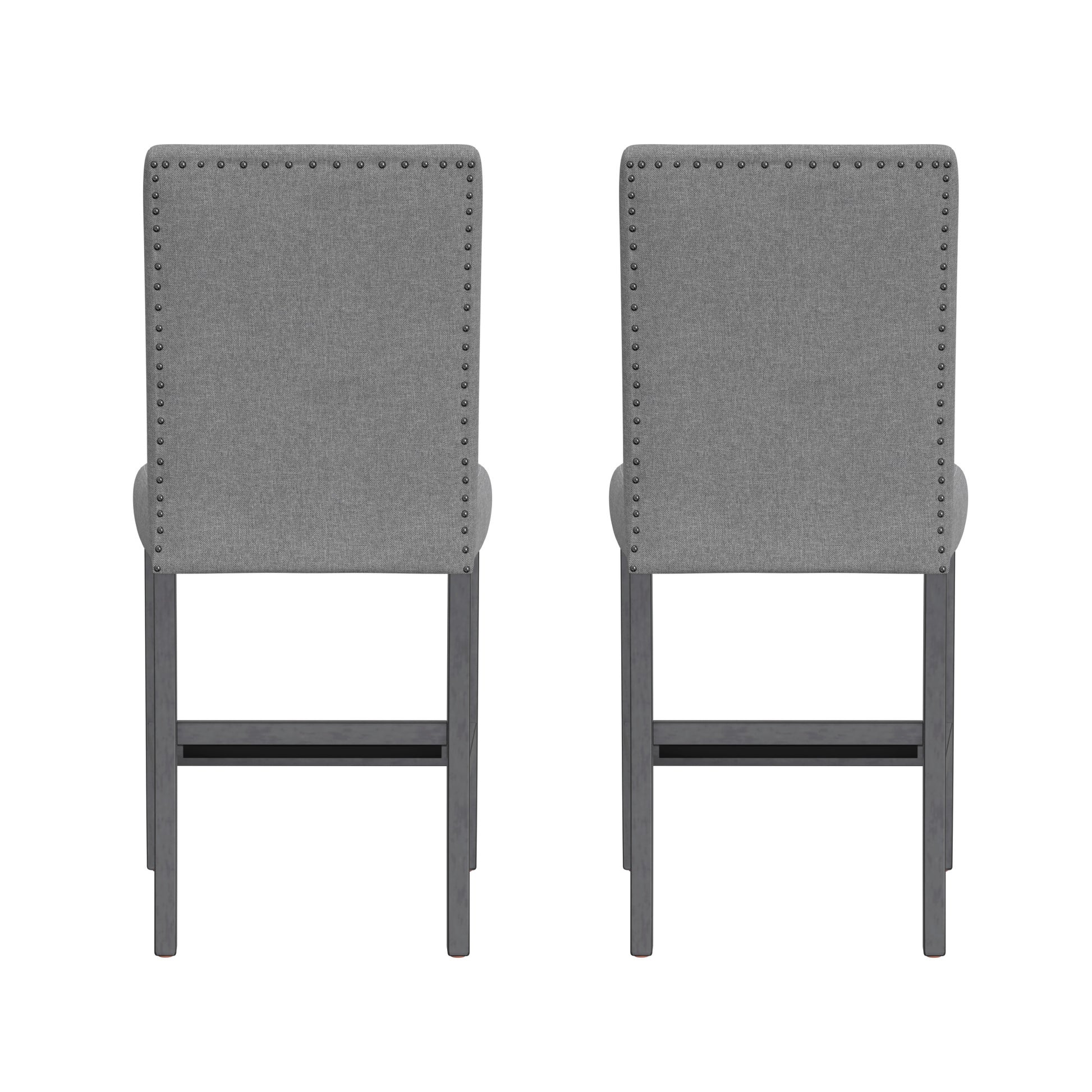 Two gray fabric bar stools with nailhead trim and dark wooden legs