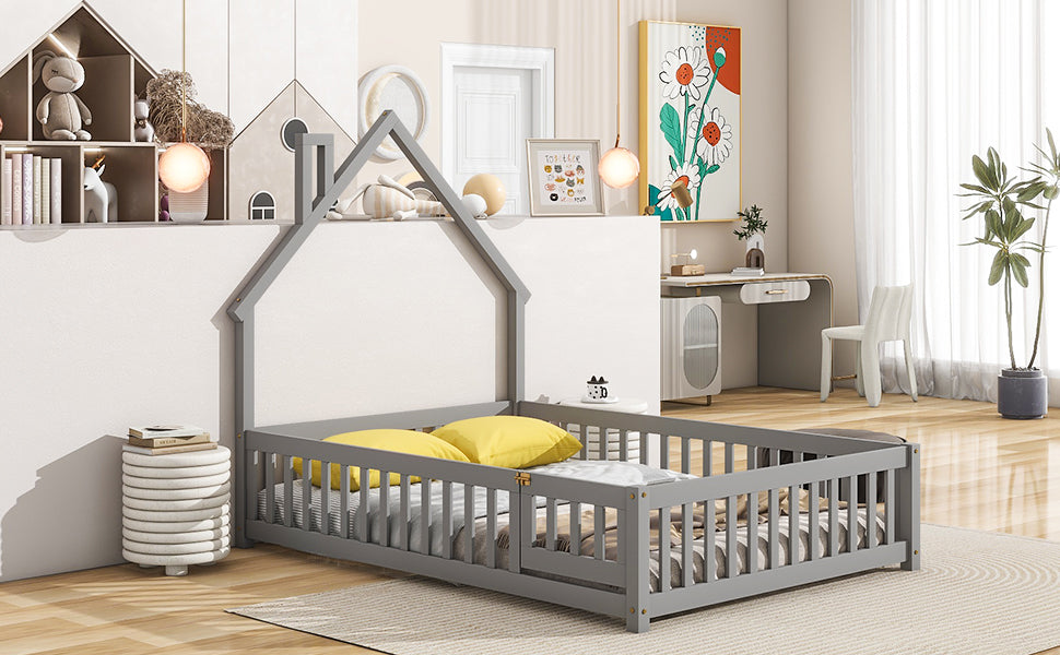 Grey wooden toddler bed with a houseshaped frame and safety rails perfect for nurseries