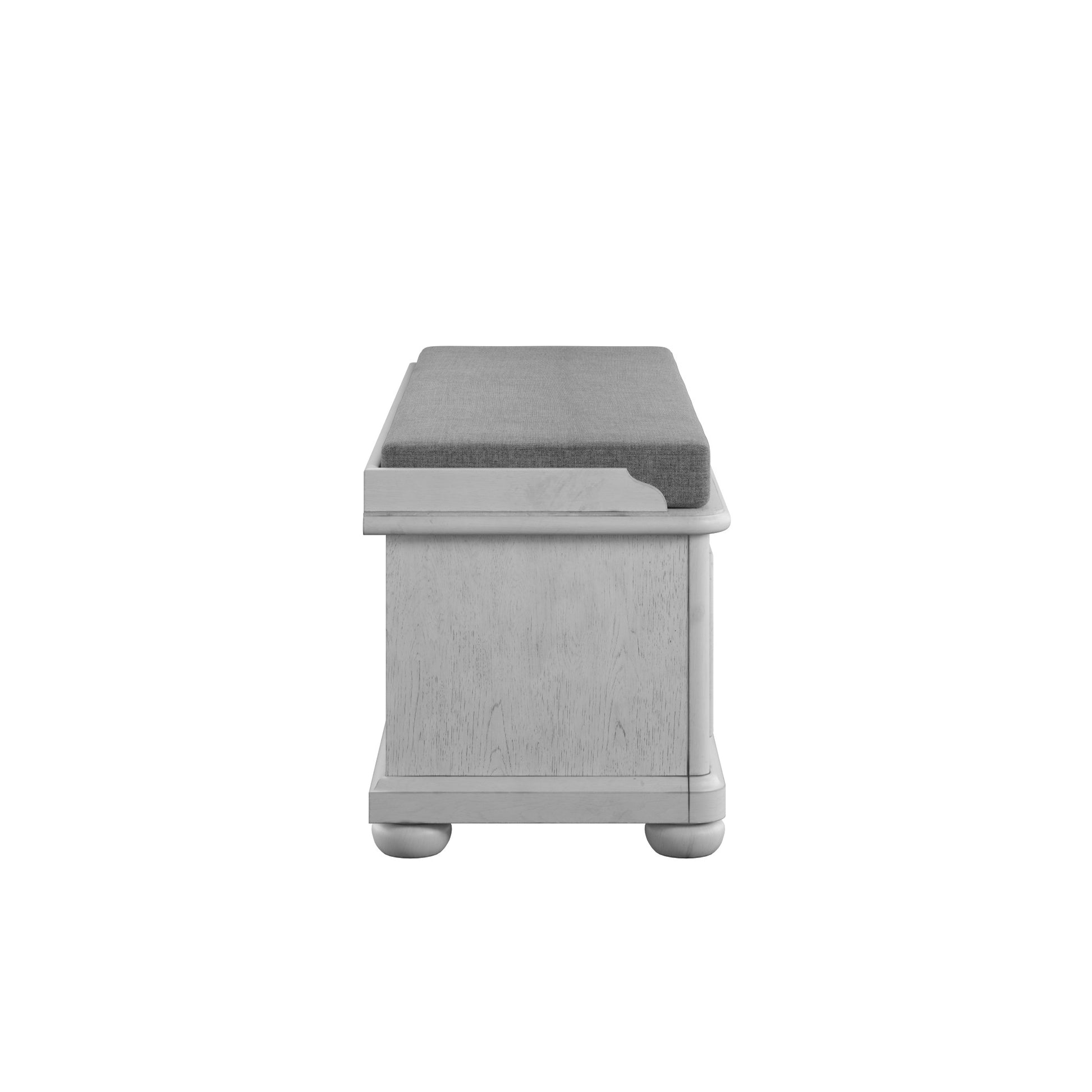 Grey upholstered storage bench with light wood finish and rounded feet