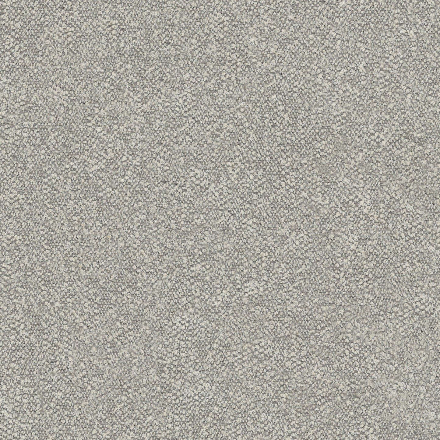 Closeup of textured grey boucle fabric for upholstery showing looped yarns and subtle variations in color for a modern feel