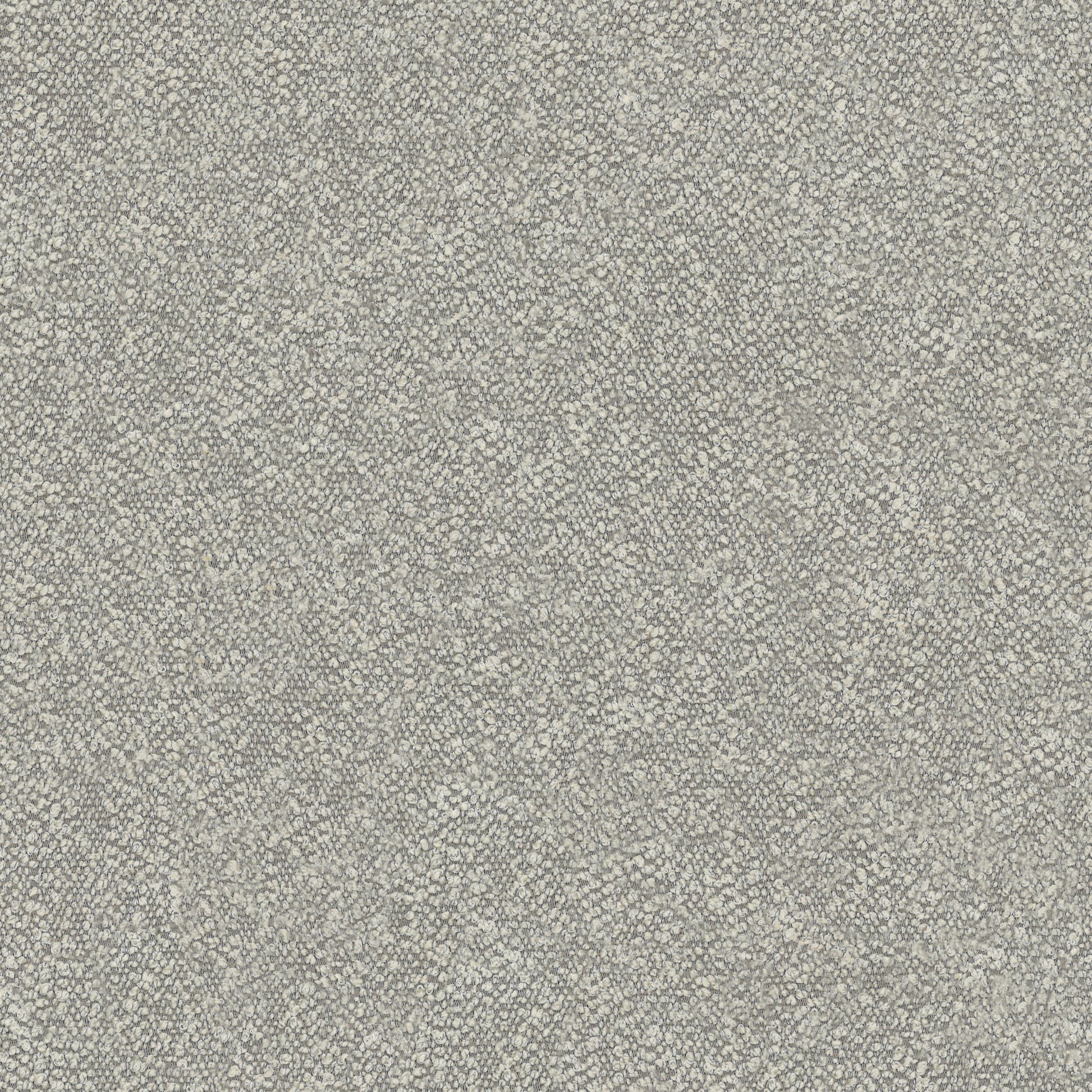 Closeup of textured grey boucle fabric for upholstery showing looped yarns and subtle variations in color for a modern feel