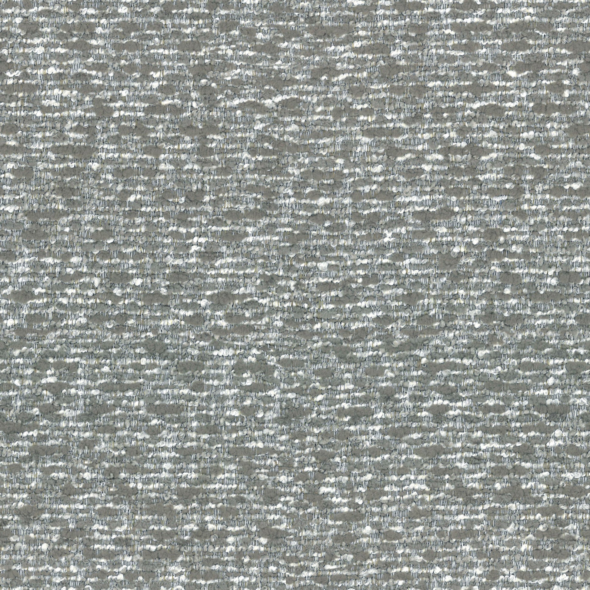 Closeup of textured grey and white boucle fabric with a subtle shimmer