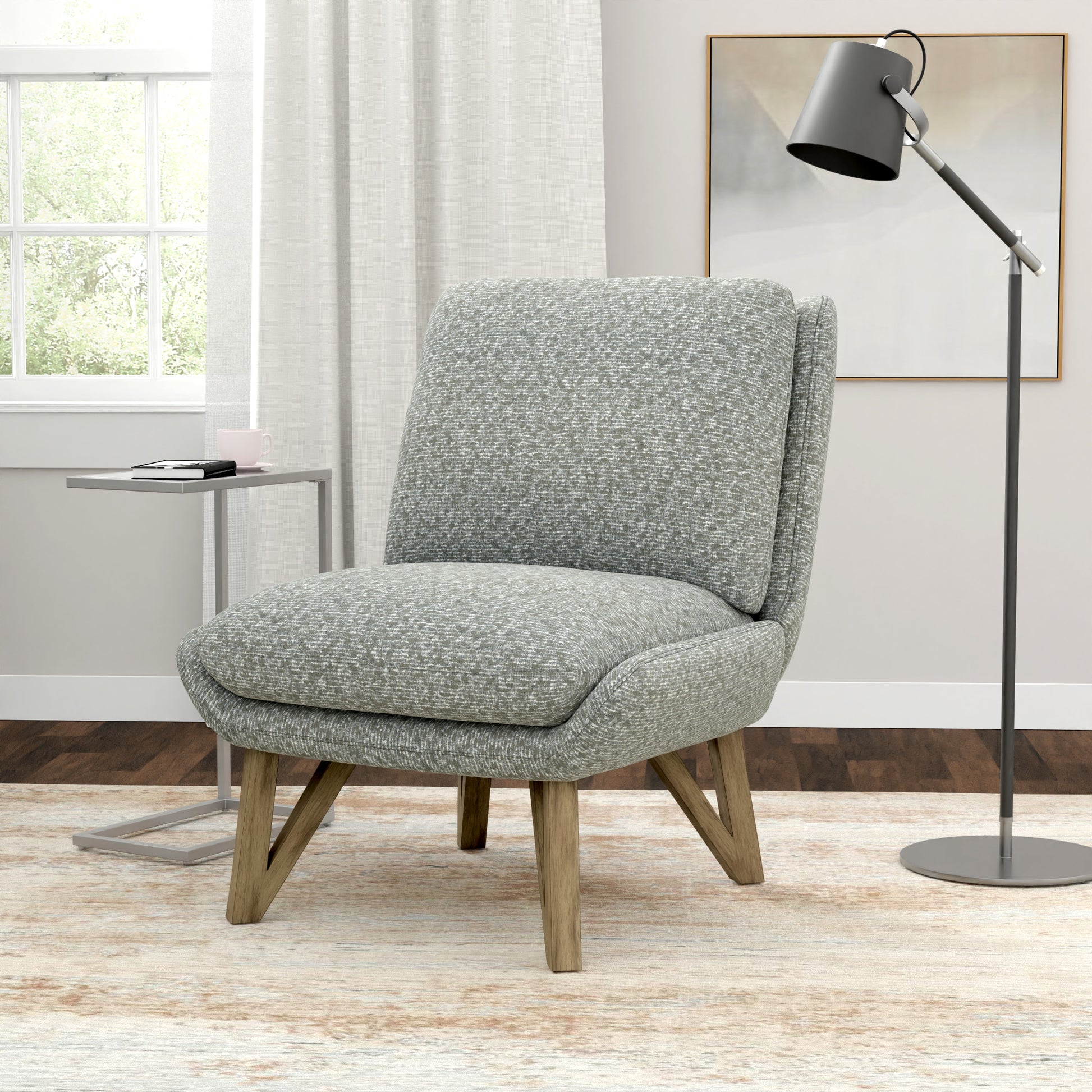 Textured grey accent chair with wooden legs and plush seating