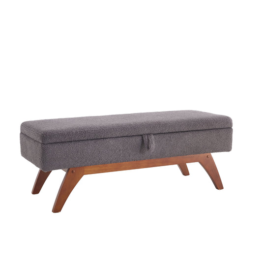 Gray boucle storage bench with midcentury modern wood legs