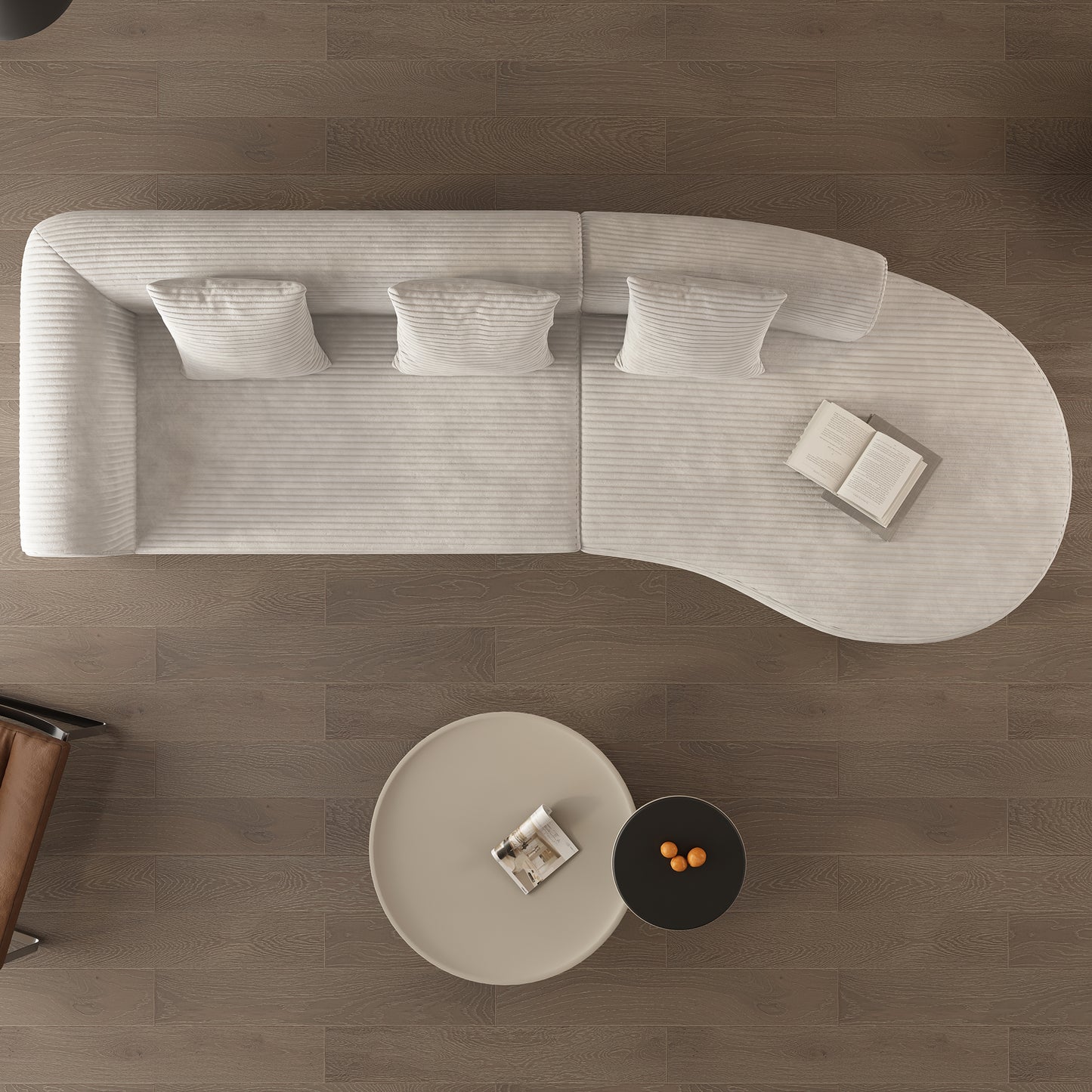 White corduroy sectional sofa with plush pillows on a dark wood floor