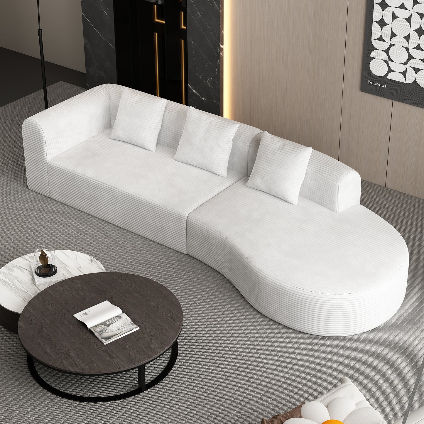 White corduroy modular sofa with curved chaise lounge and matching throw pillows