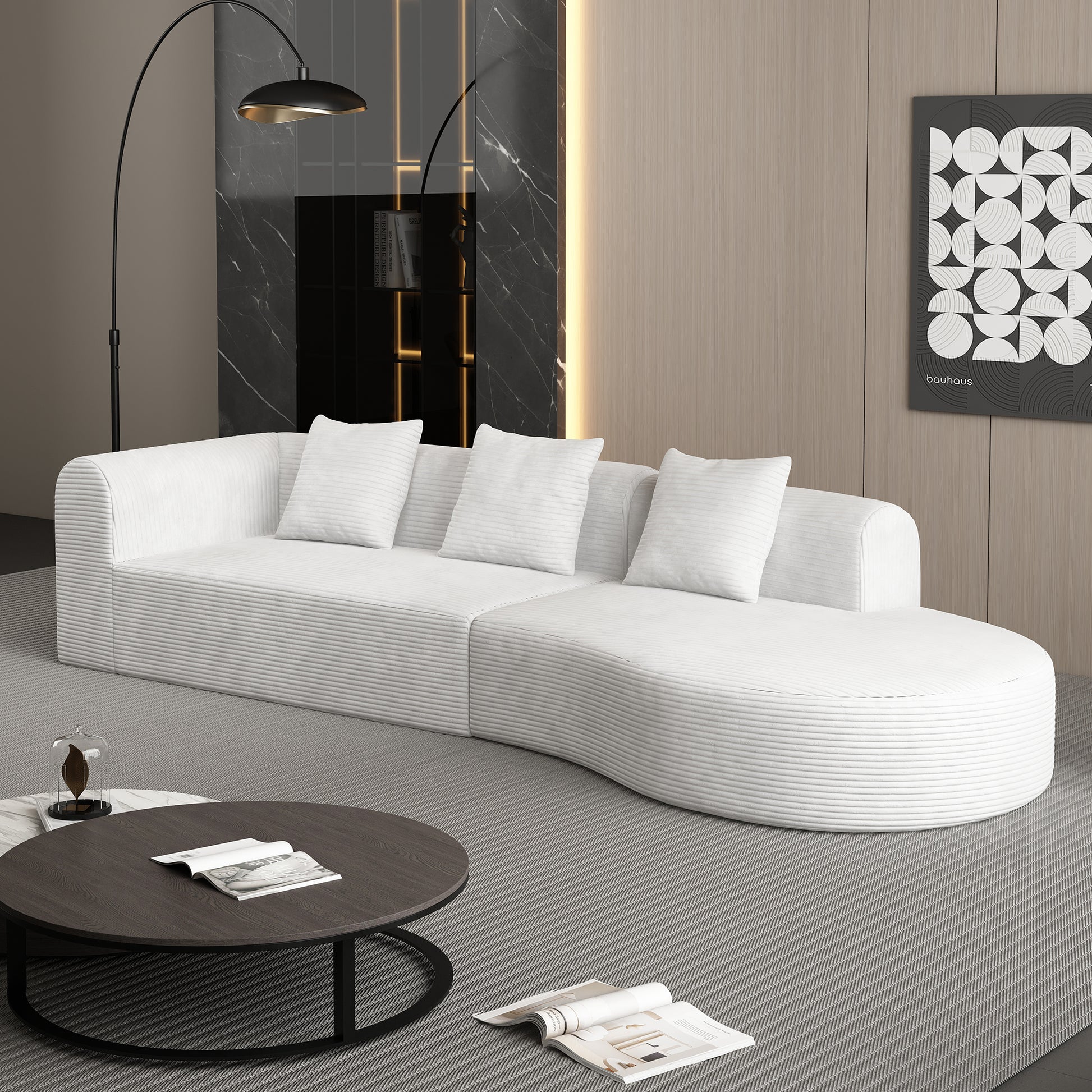 Modular white corduroy sofa with curved chaise perfect for a modern living room