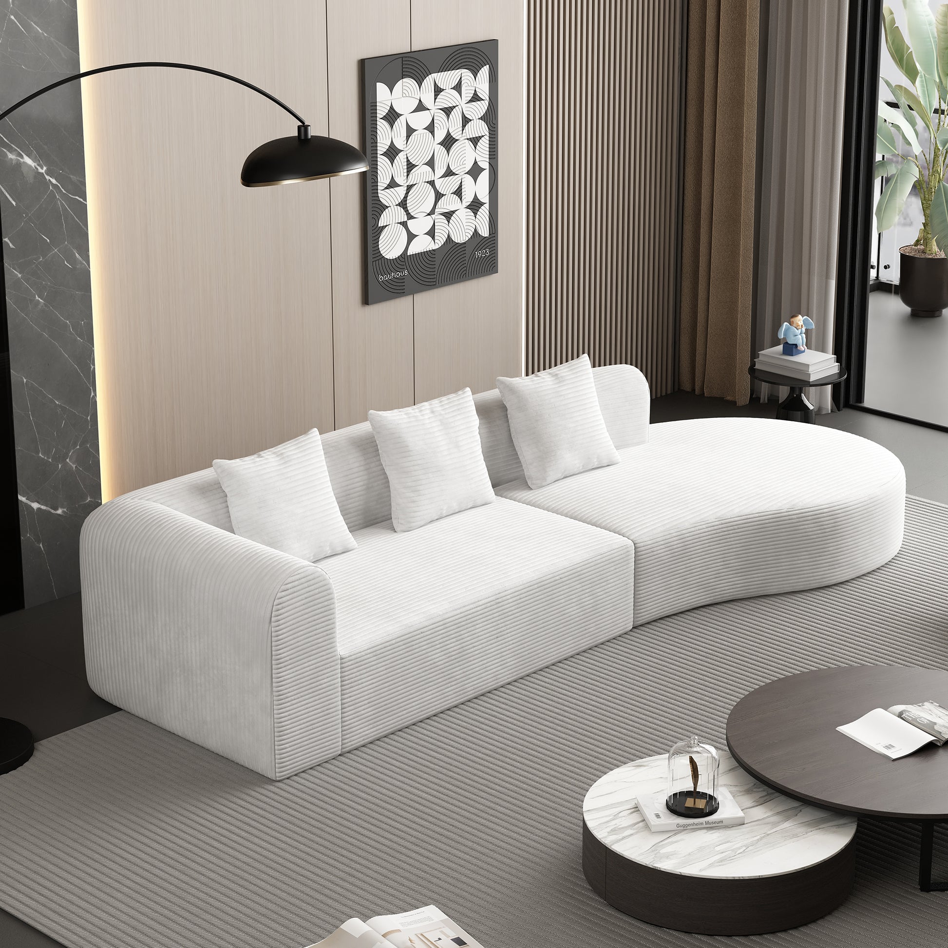 Curved white corduroy sofa with plush cushions perfect for modern living rooms