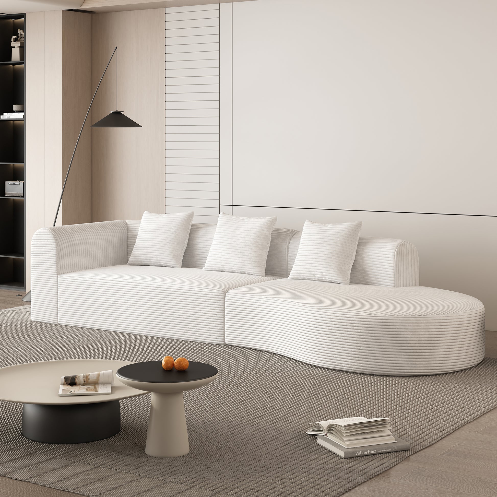 Curved white corduroy sofa with four plush pillows for modern living rooms