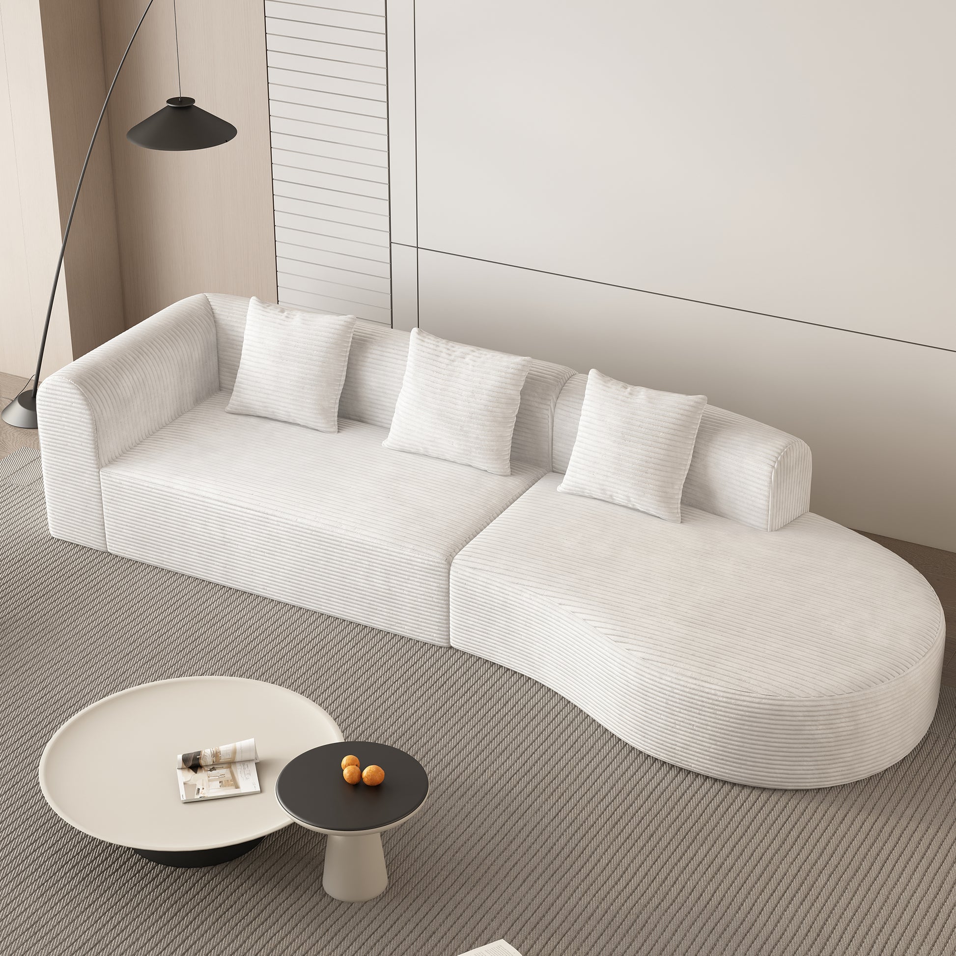 Curved white corduroy sectional sofa with plush pillows modern living room furniture