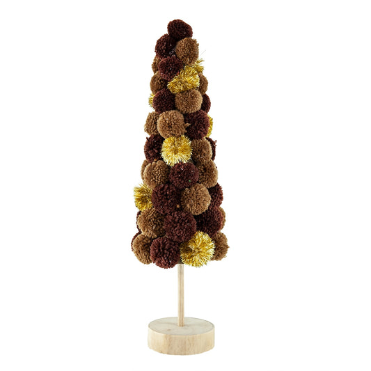 A decorative pom pom tree with brown and gold pom poms on a wooden base
