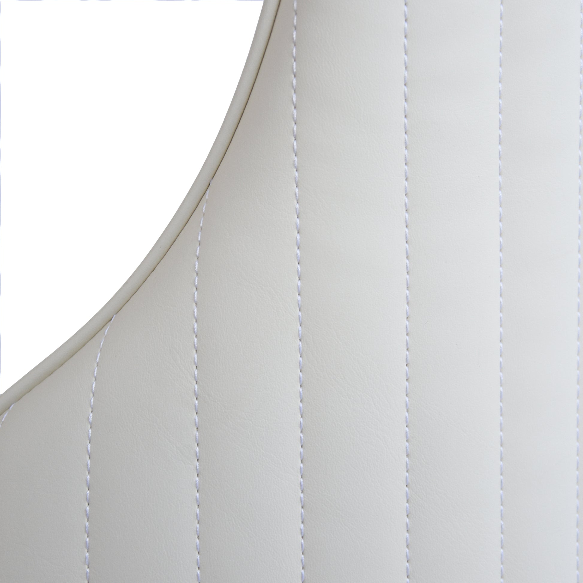 Cream faux leather sofa upholstery with white stitching detail