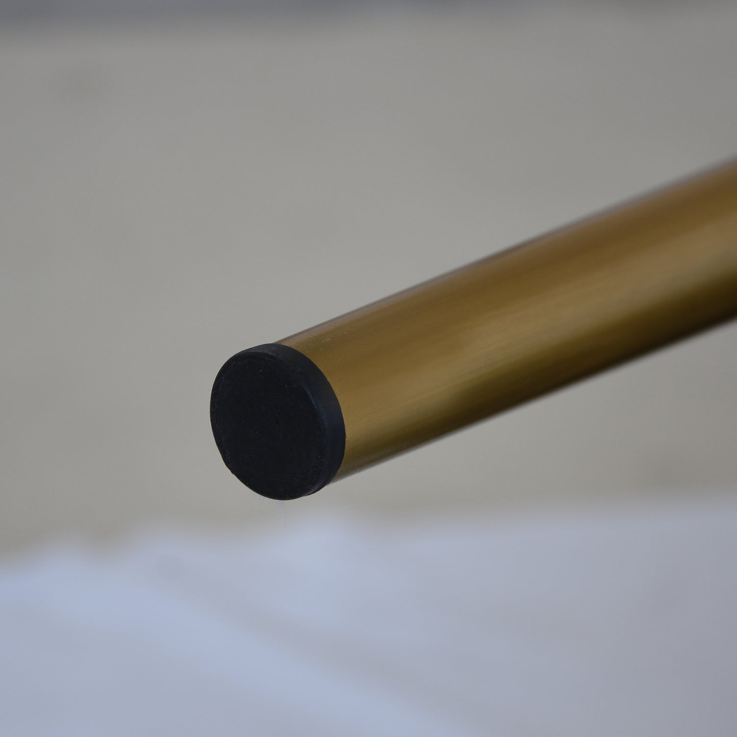 Gold metal furniture leg with black protective cap modern design